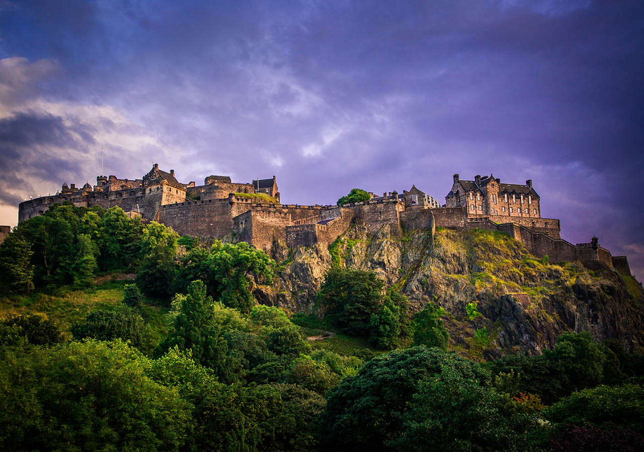 Edinburgh Castle with a dramatic sky behind it