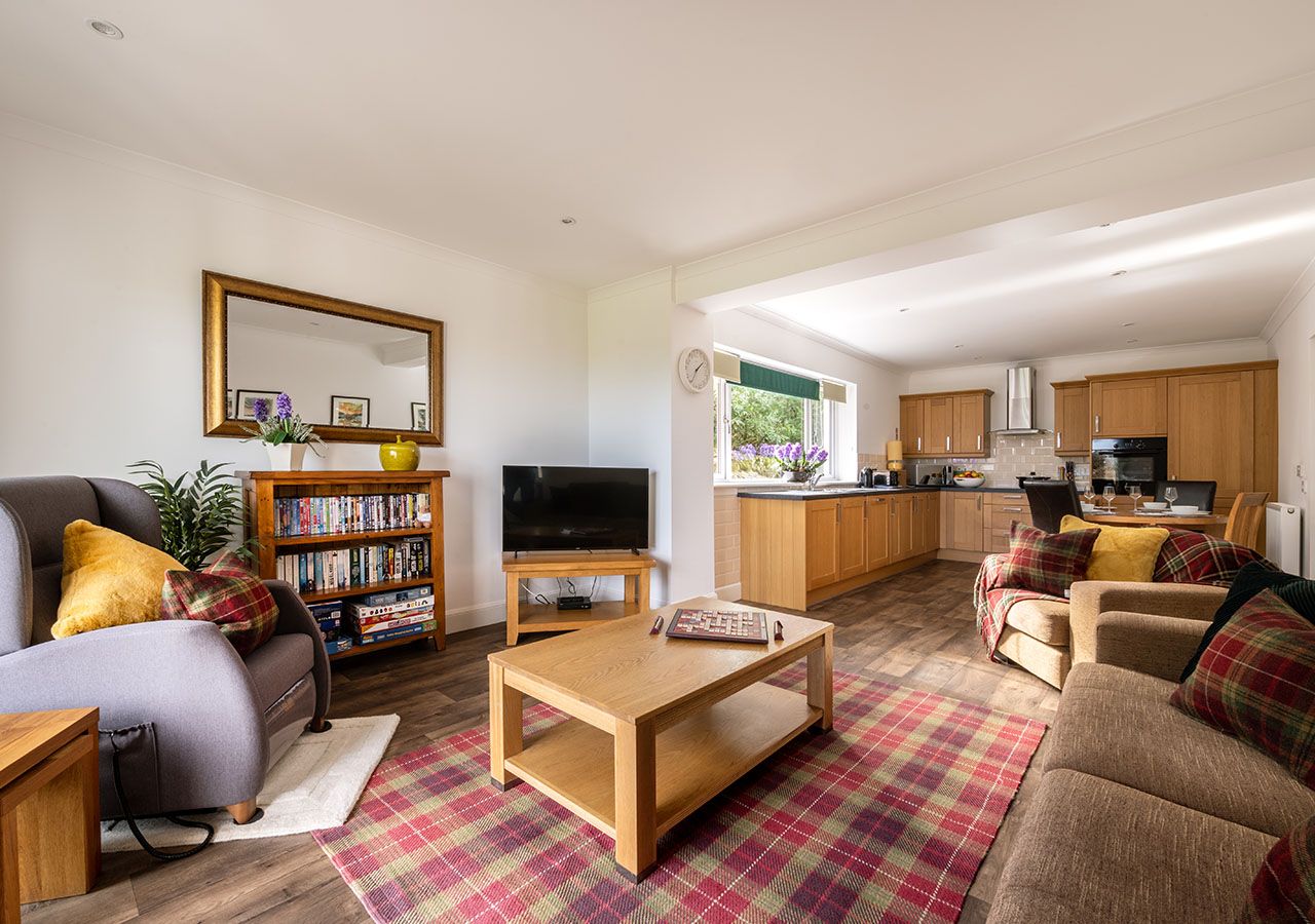 The open plan living, kitchen and dining in the accessible Lodge 6 at Elderburn Luxury Lodges