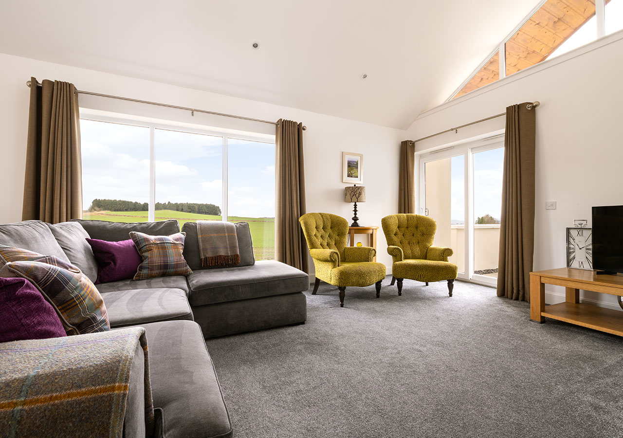 The bright airy living room in in Lodge 1 at Elderburn Luxury Lodges in Fife Scotland