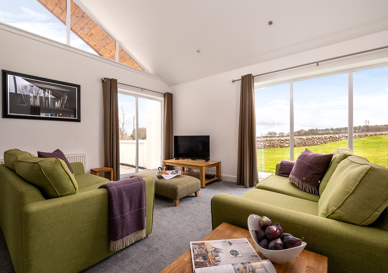 The lounge with lovely views in Lodge 2 at Elderburn Luxury Lodges