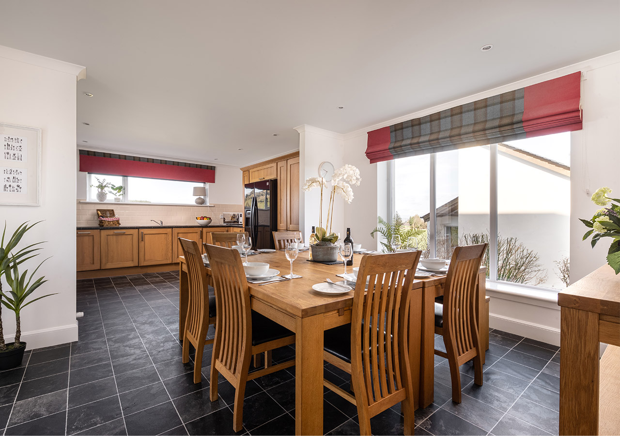 An open plan kitchen and dining area in Lodge 3 at Elderburn Luxury Lodges