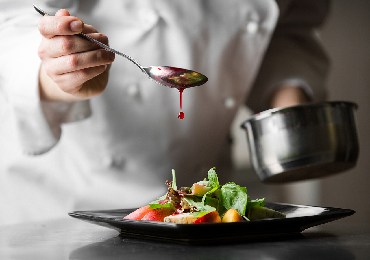 A chef plating up