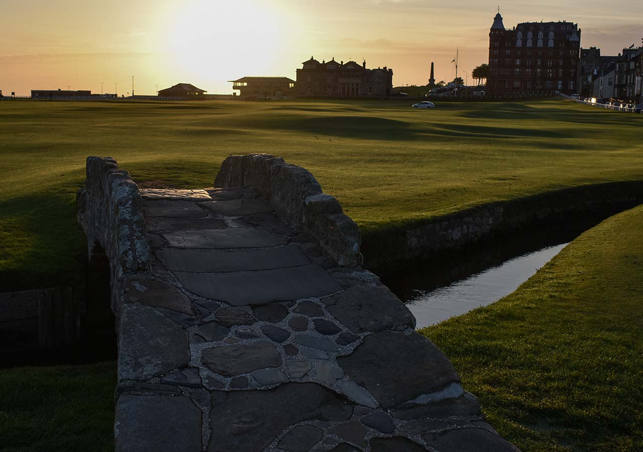 A bridge at St Andrews golf course at sunset.